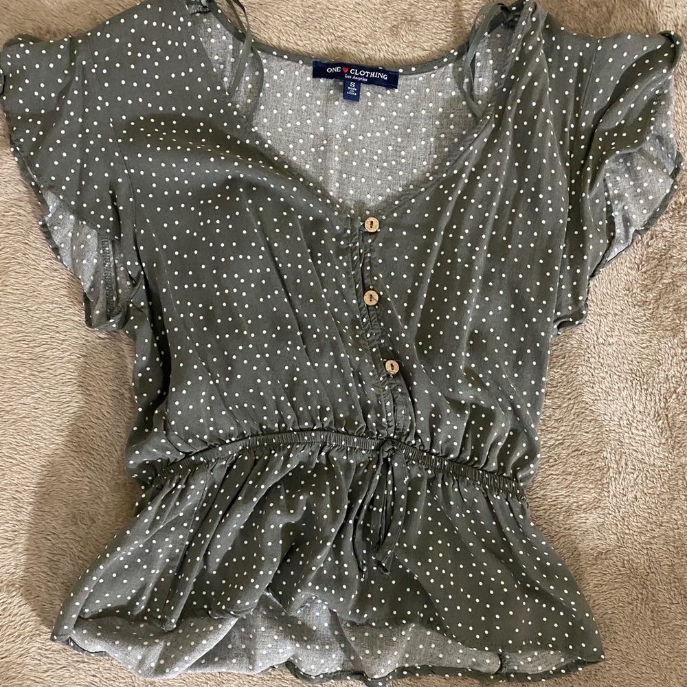 Green polka dot flows top